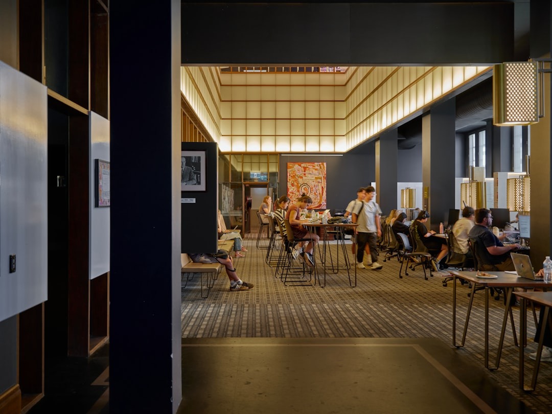 People working and talking in a modern open office.